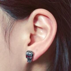 Red Eye Skull Stud Earrings For Men & Women, Stainless Steel/Crystal, 0.4 X 0.3 In -Gearup Co. Store american legend rider earrings red red eyes skeleton earrings motorcycle biker 3607706501189